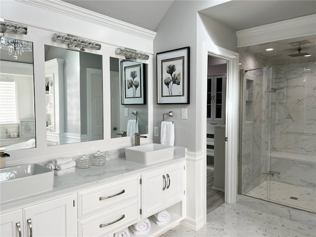 bathroom featuring crown molding, vanity, a shower with shower door, and vaulted ceiling