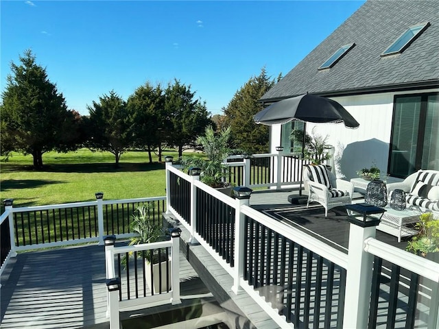 wooden deck with a yard