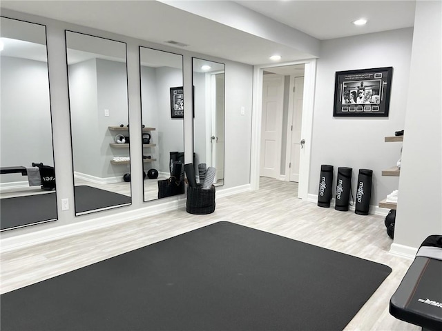 exercise area with hardwood / wood-style floors