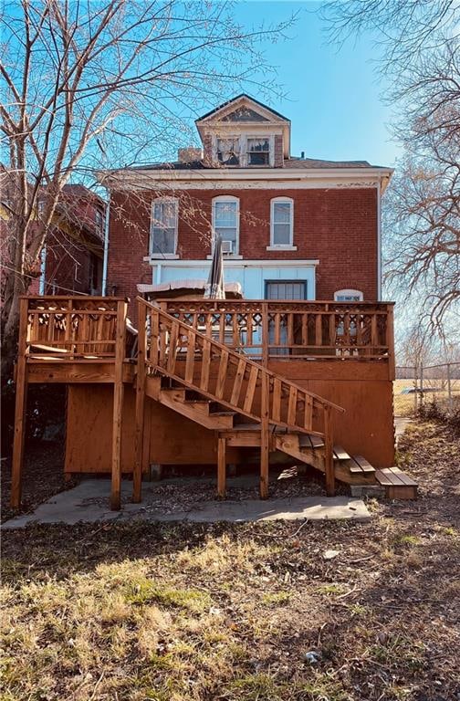 back of house with a wooden deck