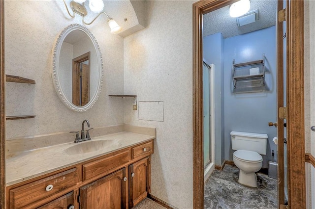 bathroom with toilet, an enclosed shower, a textured ceiling, and vanity