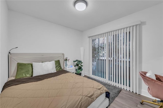 bedroom with hardwood / wood-style floors