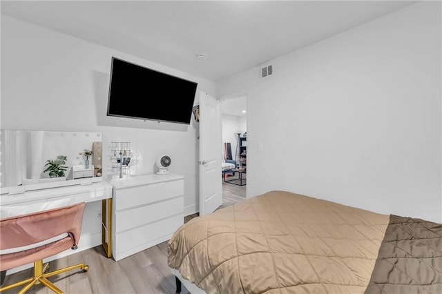 bedroom with light hardwood / wood-style floors