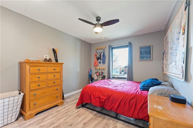 bedroom featuring ceiling fan and light wood-type flooring