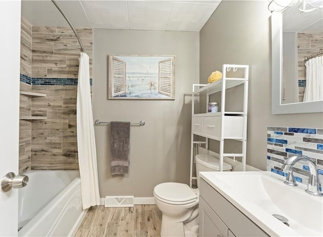 full bathroom featuring toilet, vanity, shower / tub combo, and hardwood / wood-style flooring