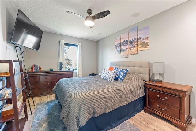 bedroom featuring ceiling fan and wood-type flooring