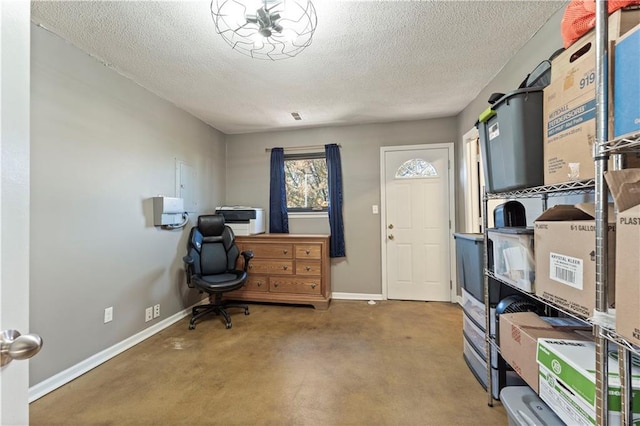 office with carpet and a textured ceiling