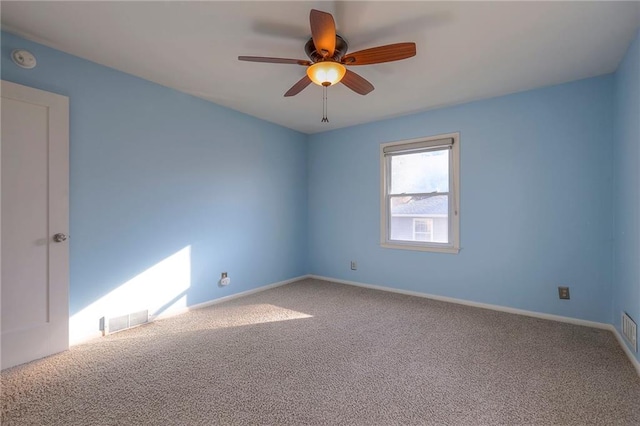 empty room featuring carpet and ceiling fan