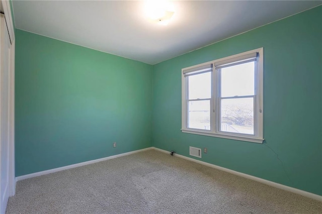 unfurnished room featuring carpet flooring