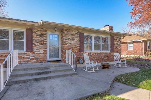 entrance to property with a patio