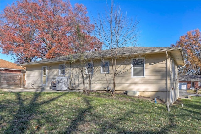 back of house with a yard