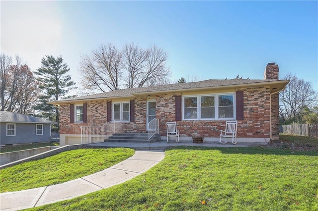 ranch-style house featuring brick siding, a front lawn, fence, a chimney, and an attached garage