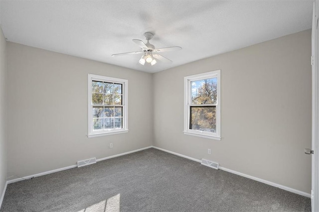 carpeted empty room with ceiling fan