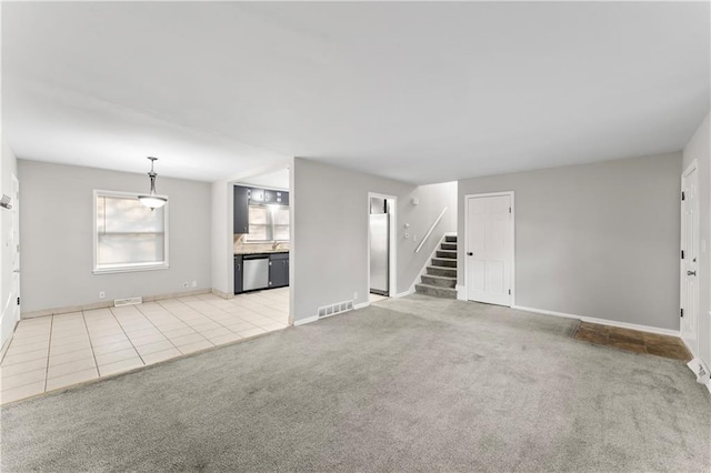 unfurnished living room with light carpet