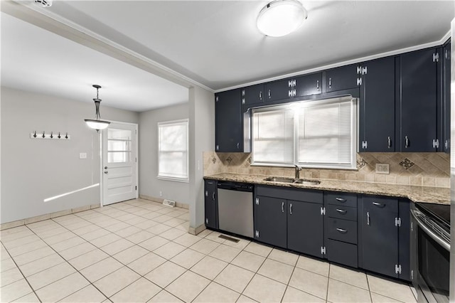 kitchen featuring a wealth of natural light, sink, stainless steel appliances, and decorative light fixtures