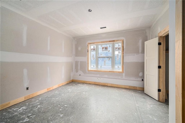 spare room featuring a textured ceiling and lofted ceiling