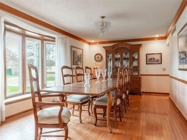 dining space featuring plenty of natural light and light wood-type flooring