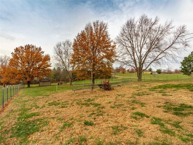 view of yard with a rural view