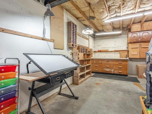 basement with a workshop area