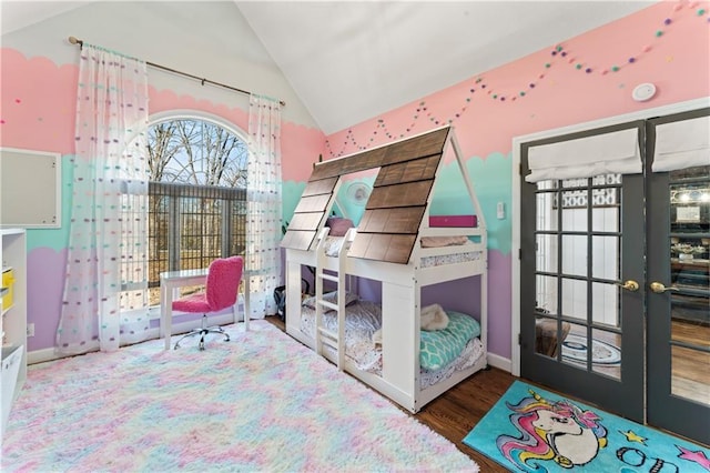 bedroom featuring vaulted ceiling, wood-type flooring, and french doors