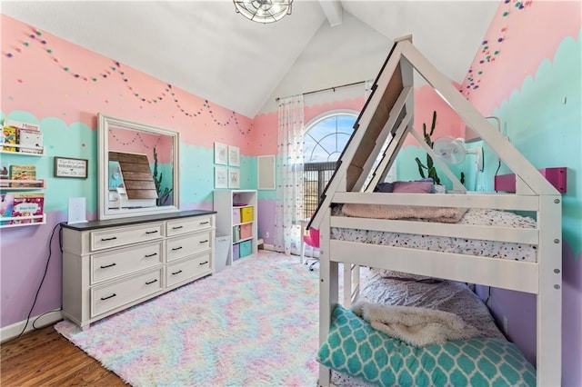 bedroom featuring lofted ceiling with beams and wood-type flooring