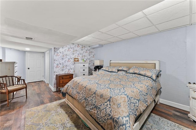 bedroom featuring dark hardwood / wood-style flooring