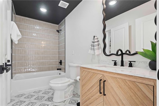 full bathroom with tile patterned flooring, visible vents, toilet, bathing tub / shower combination, and vanity