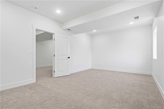 empty room featuring recessed lighting, carpet, visible vents, and baseboards