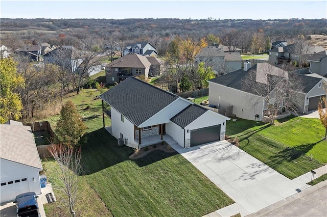 birds eye view of property with a residential view