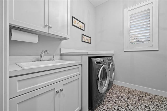 washroom with light tile patterned flooring, cabinets, separate washer and dryer, and sink