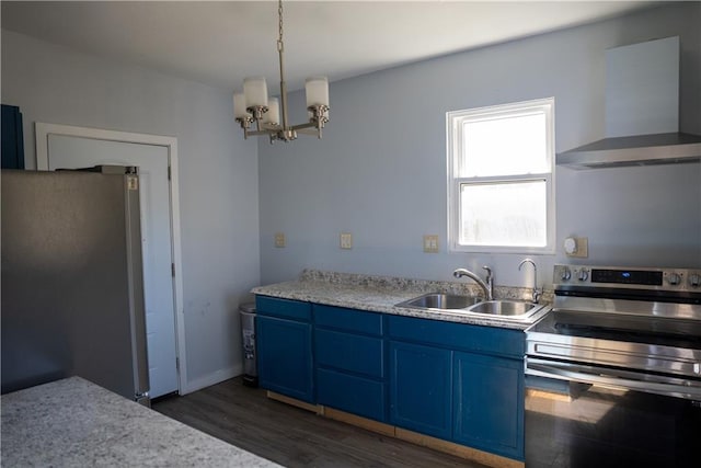 kitchen featuring appliances with stainless steel finishes, dark hardwood / wood-style flooring, wall chimney exhaust hood, blue cabinets, and sink