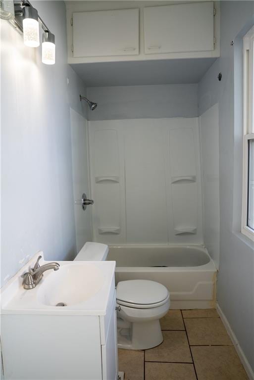 full bathroom featuring tile patterned floors, vanity, shower / bathing tub combination, and toilet