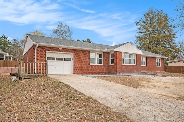 single story home with a garage