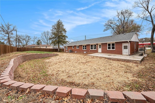 back of property featuring cooling unit