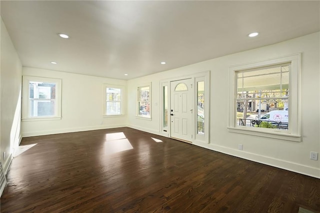 foyer entrance with dark hardwood / wood-style floors