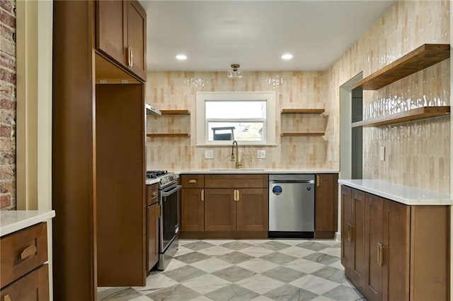 kitchen with tasteful backsplash, sink, and stainless steel appliances