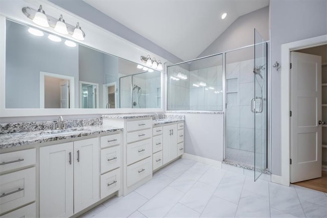 bathroom with tile patterned flooring, vanity, an enclosed shower, and vaulted ceiling