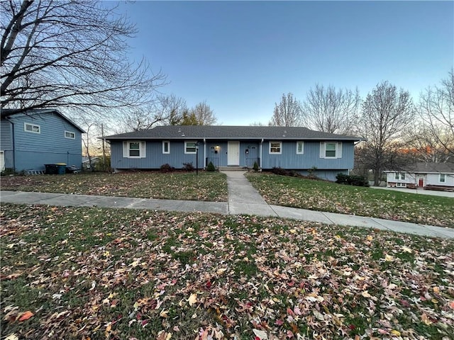 ranch-style house with a front lawn