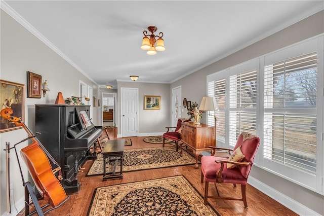 sitting room featuring hardwood / wood-style flooring and crown molding