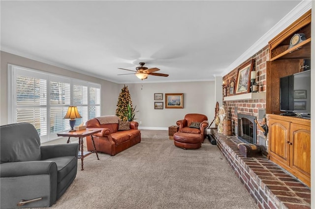 carpeted living room featuring a brick fireplace, ceiling fan, and crown molding