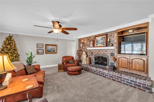 living room with carpet flooring, a brick fireplace, ceiling fan, and ornamental molding