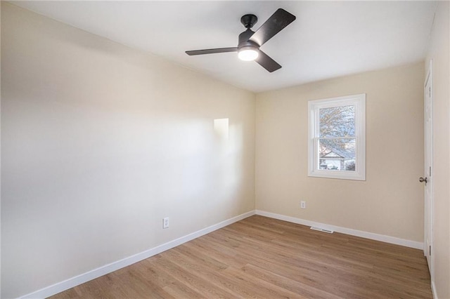 spare room featuring ceiling fan and wood-type flooring