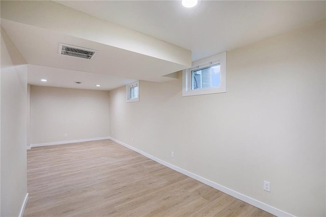 basement featuring light hardwood / wood-style floors