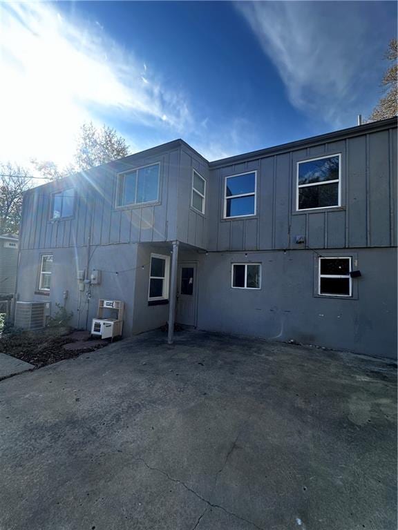 view of side of home featuring central AC unit