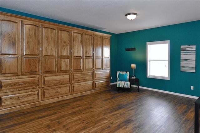 unfurnished room featuring dark hardwood / wood-style flooring