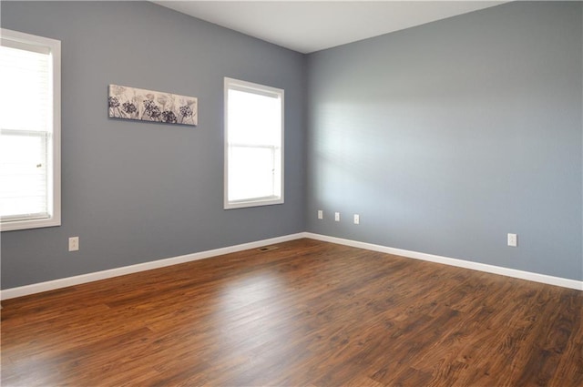 unfurnished room featuring hardwood / wood-style floors