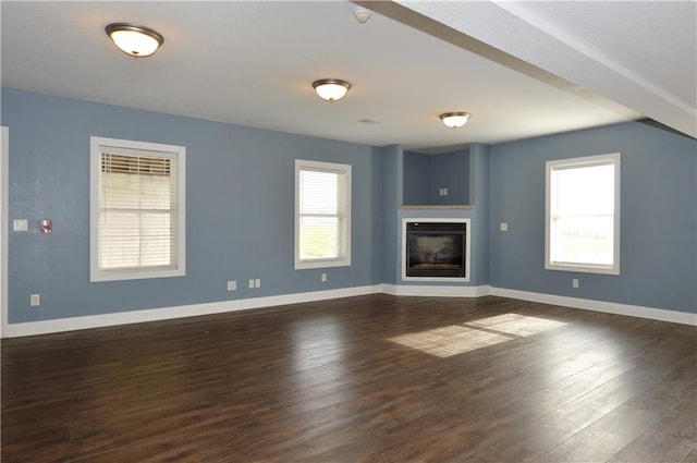 unfurnished living room featuring dark hardwood / wood-style flooring