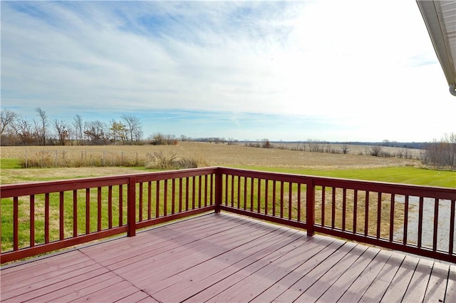 wooden terrace featuring a lawn