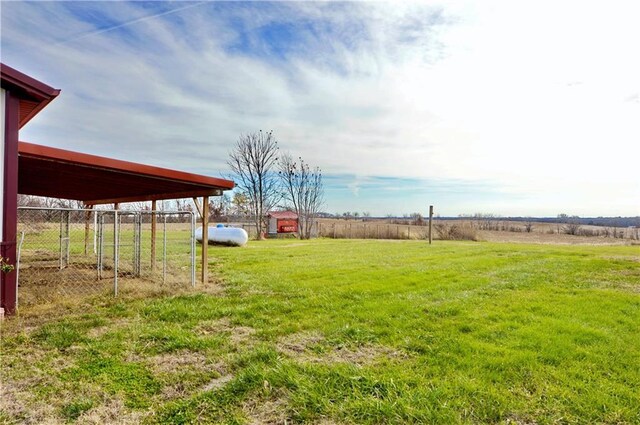 view of yard with a rural view