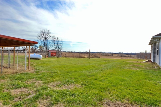 view of yard with a rural view